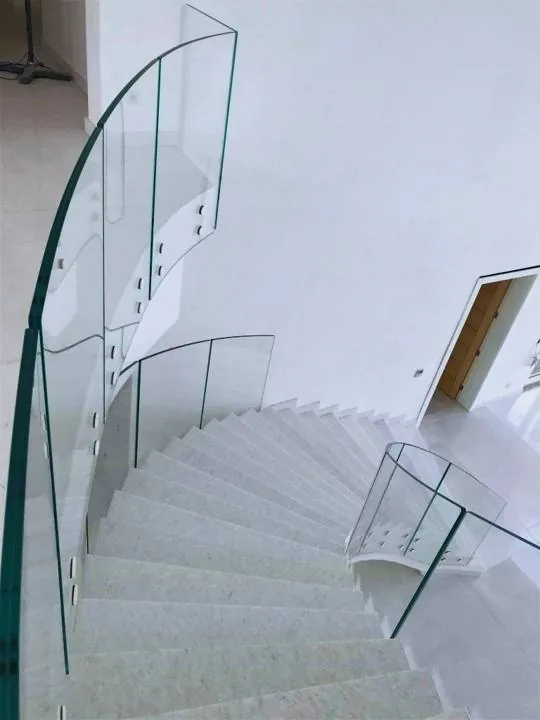Curved glass balustrade on a spiral staircase, Chouf villa