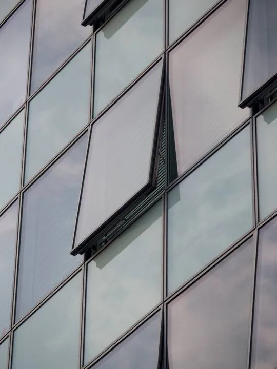 Reflective glass façade panels on aluminium framing